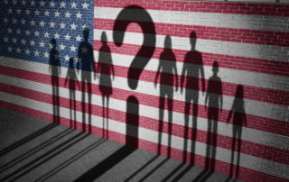 silhouettes by an american flag painted wall