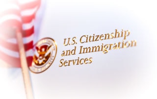 a placard labeled us citizenship and immigration services