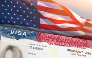 a US visa next to the american flag